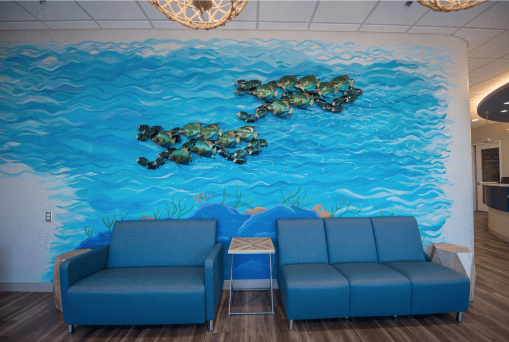 Potomac Pediatric Dentistry - Family Dentistry and Orthodontics Close shot of the chairs and mural in the waiting room of Woodbridge pediatric dentist and orthodontist Potomac Pediatric Dentistry